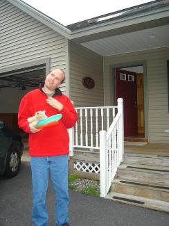 Man standing outside home